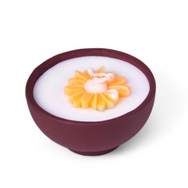 Decorative candles with orange flower design